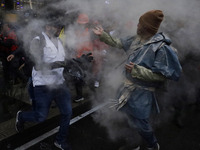 Members of the anarchist Black Bloc carry out direct action while accompanying the mothers and fathers of the 43 disappeared Ayotzinapa stud...