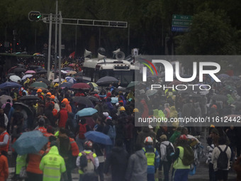 Mothers and fathers of the 43 missing Ayotzinapa students march from the Angel of Independence to the Zocalo in Mexico City, Mexico, on Sept...