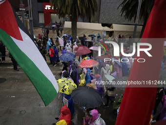 Mothers and fathers of the 43 missing Ayotzinapa students march from the Angel of Independence to the Zocalo in Mexico City, Mexico, on Sept...