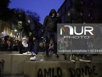 Normalista students accompany the mothers and fathers of the 43 missing Ayotzinapa students in Mexico City, Mexico, on September 26, 2024, a...