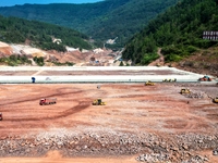 Workers work at the construction site of the Jiangjiakou Reservoir project in Jiangjiakou town, Bazhong, China, on September 25, 2024. (