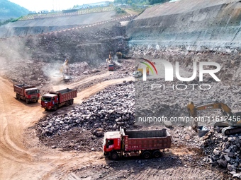 Workers work at the construction site of the Jiangjiakou Reservoir project in Jiangjiakou town, Bazhong, China, on September 25, 2024. (