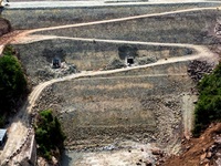 Workers work at the construction site of the Jiangjiakou Reservoir project in Jiangjiakou town, Bazhong, China, on September 25, 2024. (