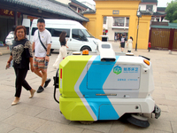 An intelligent sweeping robot works at Xuanmiaiguan Square on Guanqian Street in Suzhou, China, on September 27, 2024. (