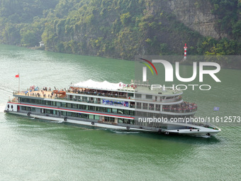 Tourists take a cruise to visit the Three Gorges of the Yangtze River on World Tourism Day in Yichang, China, on September 27, 2024. (