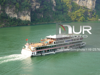 Tourists take a cruise to visit the Three Gorges of the Yangtze River on World Tourism Day in Yichang, China, on September 27, 2024. (