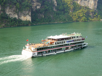 Tourists take a cruise to visit the Three Gorges of the Yangtze River on World Tourism Day in Yichang, China, on September 27, 2024. (