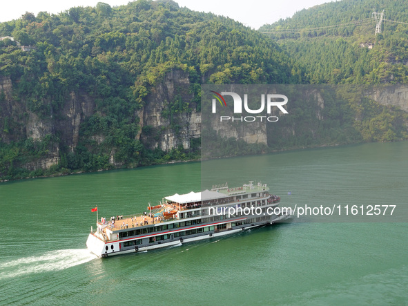 Tourists take a cruise to visit the Three Gorges of the Yangtze River on World Tourism Day in Yichang, China, on September 27, 2024. 