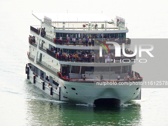 Tourists take a cruise to visit the Three Gorges of the Yangtze River on World Tourism Day in Yichang, China, on September 27, 2024. (