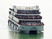 Tourists take a cruise to visit the Three Gorges of the Yangtze River on World Tourism Day in Yichang, China, on September 27, 2024. (