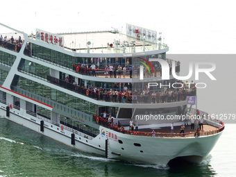 Tourists take a cruise to visit the Three Gorges of the Yangtze River on World Tourism Day in Yichang, China, on September 27, 2024. (