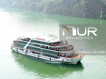 Tourists take a cruise to visit the Three Gorges of the Yangtze River on World Tourism Day in Yichang, China, on September 27, 2024. (