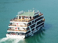 Tourists take a cruise to visit the Three Gorges of the Yangtze River on World Tourism Day in Yichang, China, on September 27, 2024. (