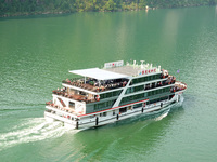 Tourists take a cruise to visit the Three Gorges of the Yangtze River on World Tourism Day in Yichang, China, on September 27, 2024. (