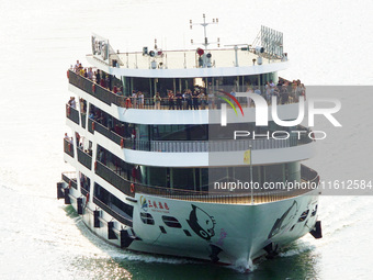 Tourists take a cruise to visit the Three Gorges of the Yangtze River on World Tourism Day in Yichang, China, on September 27, 2024. (