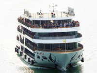 Tourists take a cruise to visit the Three Gorges of the Yangtze River on World Tourism Day in Yichang, China, on September 27, 2024. (