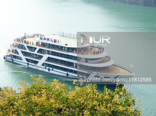 Tourists take a cruise to visit the Three Gorges of the Yangtze River on World Tourism Day in Yichang, China, on September 27, 2024. 