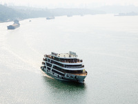 Tourists take a cruise to visit the Three Gorges of the Yangtze River on World Tourism Day in Yichang, China, on September 27, 2024. (