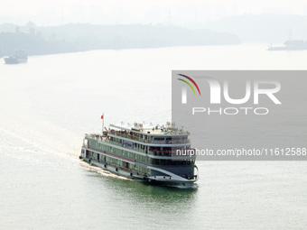 Tourists take a cruise to visit the Three Gorges of the Yangtze River on World Tourism Day in Yichang, China, on September 27, 2024. (