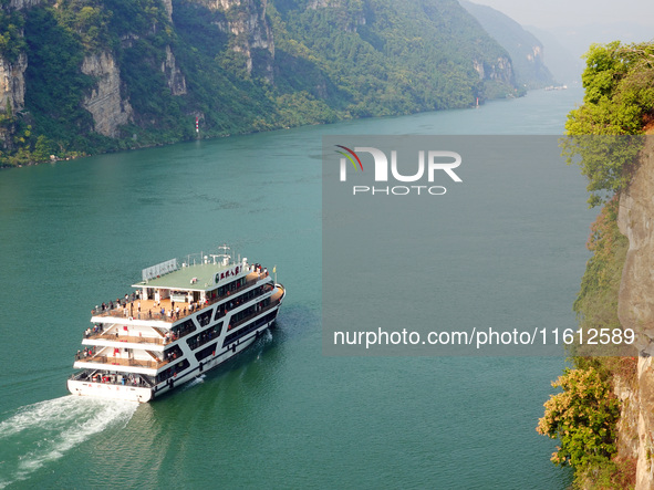 Tourists take a cruise to visit the Three Gorges of the Yangtze River on World Tourism Day in Yichang, China, on September 27, 2024. 