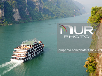 Tourists take a cruise to visit the Three Gorges of the Yangtze River on World Tourism Day in Yichang, China, on September 27, 2024. (