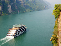 Tourists take a cruise to visit the Three Gorges of the Yangtze River on World Tourism Day in Yichang, China, on September 27, 2024. (