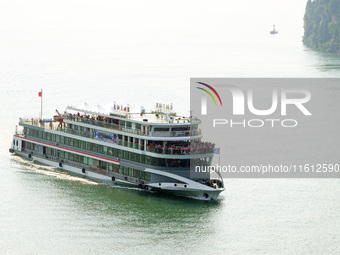 Tourists take a cruise to visit the Three Gorges of the Yangtze River on World Tourism Day in Yichang, China, on September 27, 2024. (