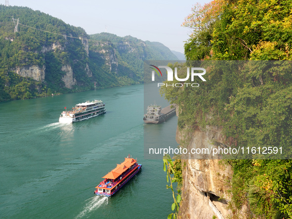 Tourists take a cruise to visit the Three Gorges of the Yangtze River on World Tourism Day in Yichang, China, on September 27, 2024. 