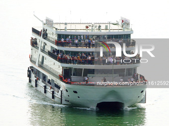 Tourists take a cruise to visit the Three Gorges of the Yangtze River on World Tourism Day in Yichang, China, on September 27, 2024. (