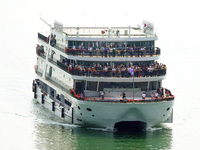 Tourists take a cruise to visit the Three Gorges of the Yangtze River on World Tourism Day in Yichang, China, on September 27, 2024. (