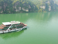 Tourists take a cruise to visit the Three Gorges of the Yangtze River on World Tourism Day in Yichang, China, on September 27, 2024. (