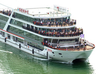 Tourists take a cruise to visit the Three Gorges of the Yangtze River on World Tourism Day in Yichang, China, on September 27, 2024. (