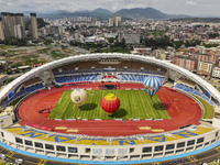 Hot air balloons and drones are displayed at the event of the China International Aircraft Design Challenge 2024 (Fujian Station) at the New...