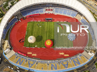 Hot air balloons and drones are displayed at the event of the China International Aircraft Design Challenge 2024 (Fujian Station) at the New...