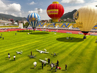 Hot air balloons and drones are displayed at the event of the China International Aircraft Design Challenge 2024 (Fujian Station) at the New...