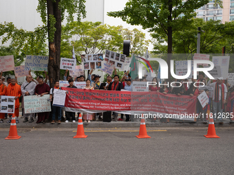 Around 100 members of the Korean Jumma Association gather near the Embassy of Bangladesh in Seoul, South Korea, on September 27, 2024, to pr...