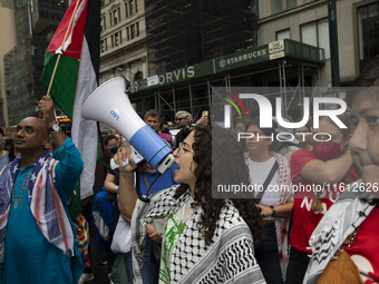 A pro-Palestinian person chants during a protest in Bryant Park, New York City, USA, on September 26, 2024. Hundreds gather for demonstratio...