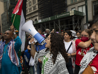 A pro-Palestinian person chants during a protest in Bryant Park, New York City, USA, on September 26, 2024. Hundreds gather for demonstratio...