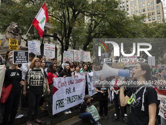 A pro-Palestinian person chants during a protest in Bryant Park, New York City, USA, on September 26, 2024. Hundreds gather for demonstratio...