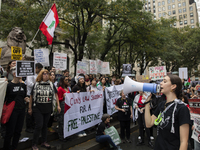 A pro-Palestinian person chants during a protest in Bryant Park, New York City, USA, on September 26, 2024. Hundreds gather for demonstratio...