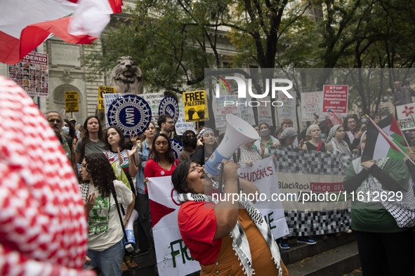 A pro-Palestinian person chants during a protest in Bryant Park, New York City, USA, on September 26, 2024. Hundreds gather for demonstratio...