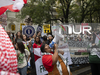 A pro-Palestinian person chants during a protest in Bryant Park, New York City, USA, on September 26, 2024. Hundreds gather for demonstratio...