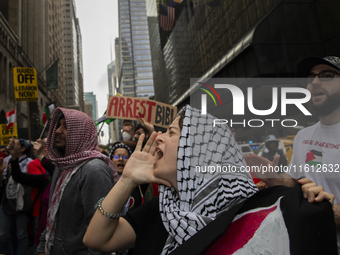 A pro-Palestinian person chants during a protest in New York City, USA, on September 26, 2024. Hundreds gather for demonstrations against Is...