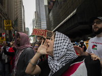 A pro-Palestinian person chants during a protest in New York City, USA, on September 26, 2024. Hundreds gather for demonstrations against Is...