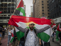 A person holds a Lebanese flag during a pro-Palestinian protest in New York City, USA, on September 26, 2024. Hundreds gather for demonstrat...