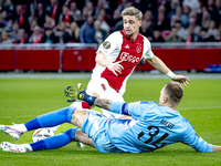 AFC Ajax Amsterdam midfielder Kenneth Taylor and Besiktas JK goalkeeper Mert Gunok during the match between Ajax and Besiktas at the Johan C...