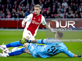 AFC Ajax Amsterdam midfielder Kenneth Taylor and Besiktas JK goalkeeper Mert Gunok during the match between Ajax and Besiktas at the Johan C...