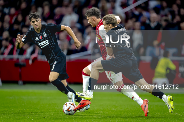 AFC Ajax Amsterdam forward Mika Godts and Besiktas JK defender Jonas Svensson during the match between Ajax and Besiktas at the Johan Cruijf...