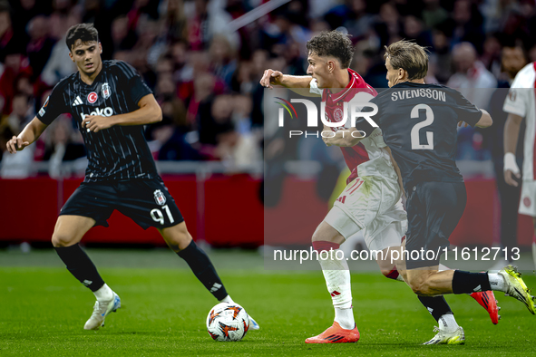 AFC Ajax Amsterdam forward Mika Godts and Besiktas JK defender Jonas Svensson during the match between Ajax and Besiktas at the Johan Cruijf...