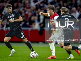 AFC Ajax Amsterdam forward Mika Godts and Besiktas JK defender Jonas Svensson during the match between Ajax and Besiktas at the Johan Cruijf...